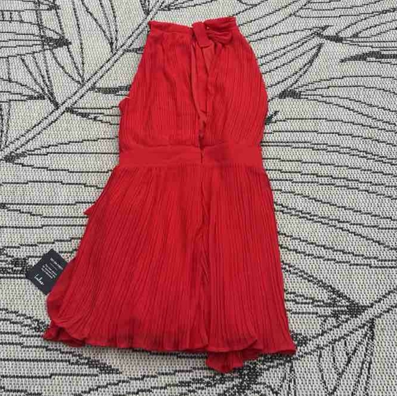 Lulu's Red Pleated Faux Wrap Tie-Side Skort Romper - Picture 4 of 6